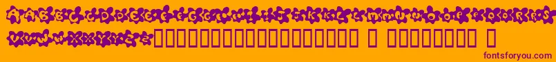 Czcionka FriedEggsSmallcaps – fioletowe czcionki na pomarańczowym tle