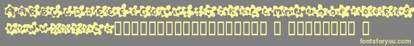 FriedEggsSmallcaps Font – Yellow Fonts on Gray Background