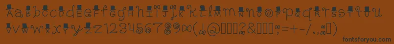 フォントFancy – 黒い文字が茶色の背景にあります