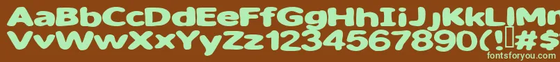 フォントSweet ffy – 緑色の文字が茶色の背景にあります。