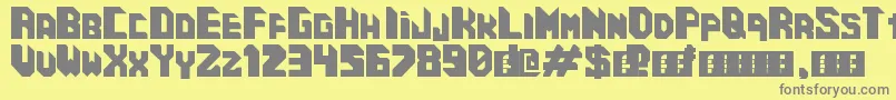 CosmicCube-Schriftart – Graue Schriften auf gelbem Hintergrund