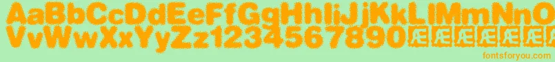 フォントDephunkedBrk – オレンジの文字が緑の背景にあります。