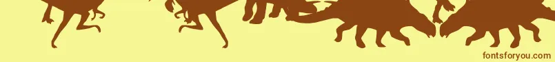 Dingosaurs Font – Brown Fonts on Yellow Background