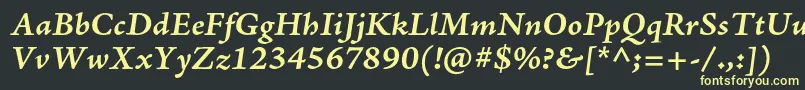 AjensonproBolditcapt Font – Yellow Fonts on Black Background