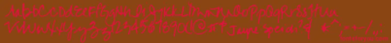 フォントJayne – 赤い文字が茶色の背景にあります。