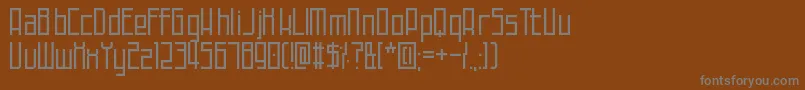 フォントTechnoAtDusk – 茶色の背景に灰色の文字