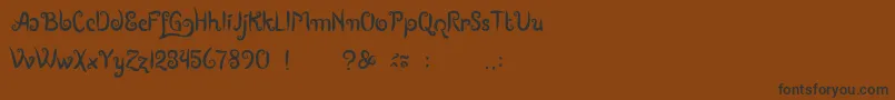 フォントBoutiquesOfMerauke – 黒い文字が茶色の背景にあります