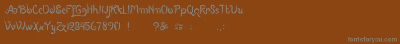 BoutiquesOfMerauke Font – Gray Fonts on Brown Background