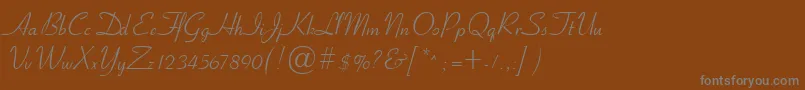 Cyrillicribbon-fontti – harmaat kirjasimet ruskealla taustalla