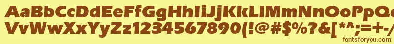 フォントErasultrac – 茶色の文字が黄色の背景にあります。