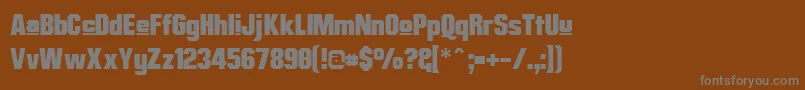 MisterBelvedereUpper-fontti – harmaat kirjasimet ruskealla taustalla