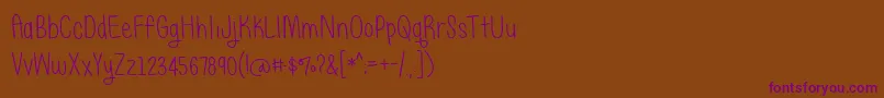 BmdJustAlice Font – Purple Fonts on Brown Background