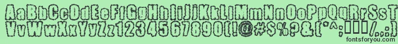 Pinniepo-Schriftart – Schwarze Schriften auf grünem Hintergrund