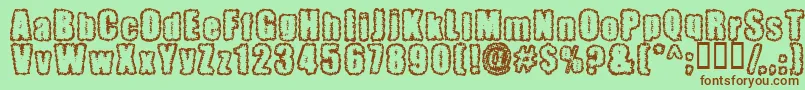 Pinniepo Font – Brown Fonts on Green Background