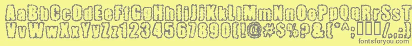 Pinniepo-Schriftart – Graue Schriften auf gelbem Hintergrund