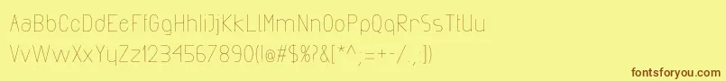 フォントExactaLight – 茶色の文字が黄色の背景にあります。