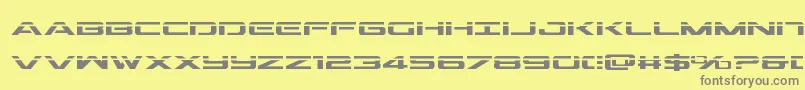 フォントOutriderlaser – 黄色の背景に灰色の文字