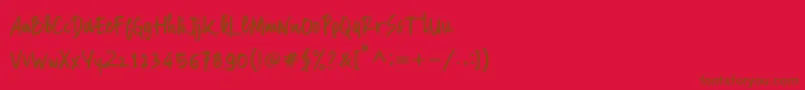 Manksa-Schriftart – Braune Schriften auf rotem Hintergrund