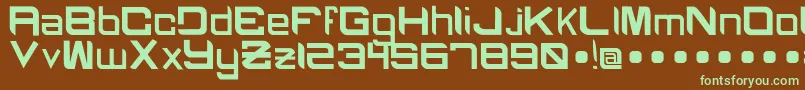 フォントBlackcapsRegular – 緑色の文字が茶色の背景にあります。