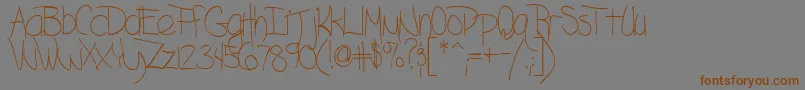 BlazingRegularTtstd Font – Brown Fonts on Gray Background
