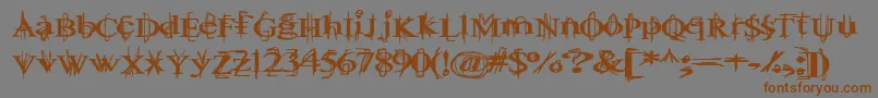 フォントBallTongue – 茶色の文字が灰色の背景にあります。