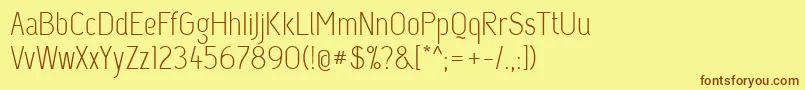 フォントCapsuula – 茶色の文字が黄色の背景にあります。