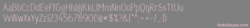 フォントCapsuula – 灰色の背景にピンクのフォント