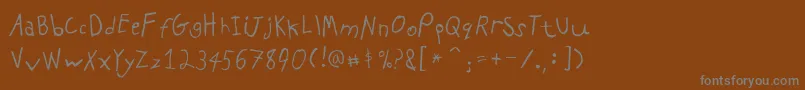 フォントPfkidsproGradeone – 茶色の背景に灰色の文字