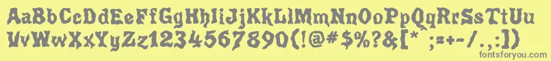 フォントPoultryg – 黄色の背景に灰色の文字