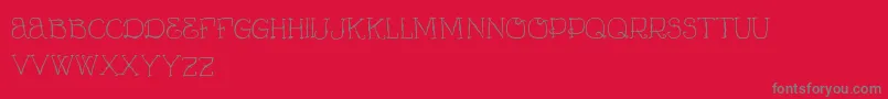 VtksCurumin-Schriftart – Graue Schriften auf rotem Hintergrund