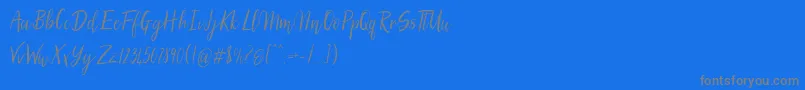 SilhouettoScript-Schriftart – Graue Schriften auf blauem Hintergrund