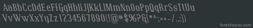 フォントCovingtonRevBoldItalic – 黒い背景に灰色の文字