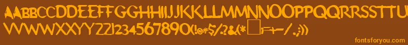 フォントSchooldaze – オレンジ色の文字が茶色の背景にあります。