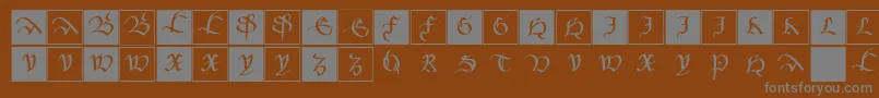 フォントMkancellerescacaps – 茶色の背景に灰色の文字