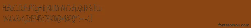 Czcionka Asenst – czarne czcionki na brązowym tle