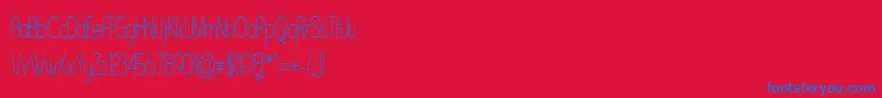 Czcionka Asenst – niebieskie czcionki na czerwonym tle