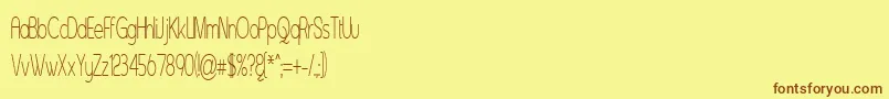 Czcionka Asenst – brązowe czcionki na żółtym tle