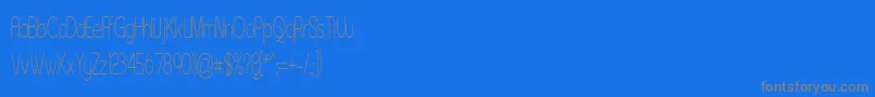 Czcionka Asenst – szare czcionki na niebieskim tle