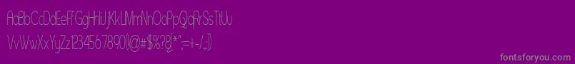 Asenst-fontti – harmaat kirjasimet violetilla taustalla