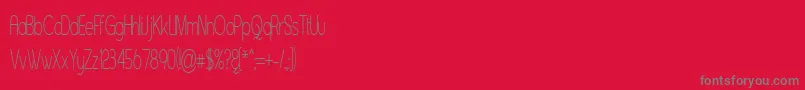 Asenst-fontti – harmaat kirjasimet punaisella taustalla