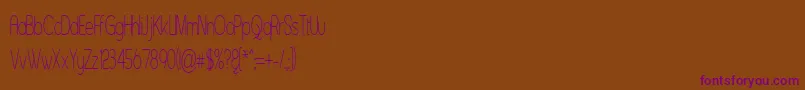 Czcionka Asenst – fioletowe czcionki na brązowym tle
