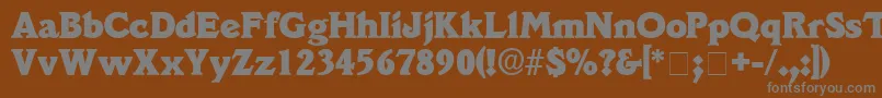 DecusSsi-fontti – harmaat kirjasimet ruskealla taustalla