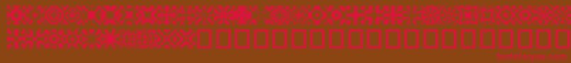 フォントKitchent – 赤い文字が茶色の背景にあります。