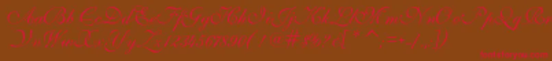 フォントIlsScript – 赤い文字が茶色の背景にあります。