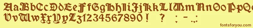 フォントMinim – 茶色の文字が黄色の背景にあります。