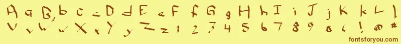 フォントQwikscribblenormal – 茶色の文字が黄色の背景にあります。