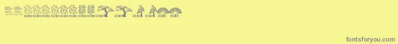 Fonte Ftkingsgardendemo – fontes cinzas em um fundo amarelo