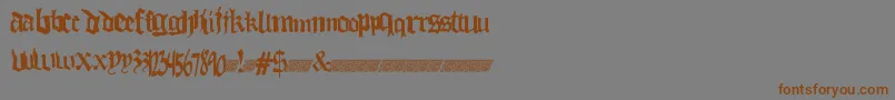 フォントThuglovedt – 茶色の文字が灰色の背景にあります。