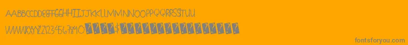 Seamingstitchy-Schriftart – Graue Schriften auf orangefarbenem Hintergrund