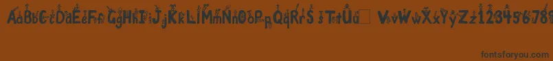 GirlsNBoys-Schriftart – Schwarze Schriften auf braunem Hintergrund